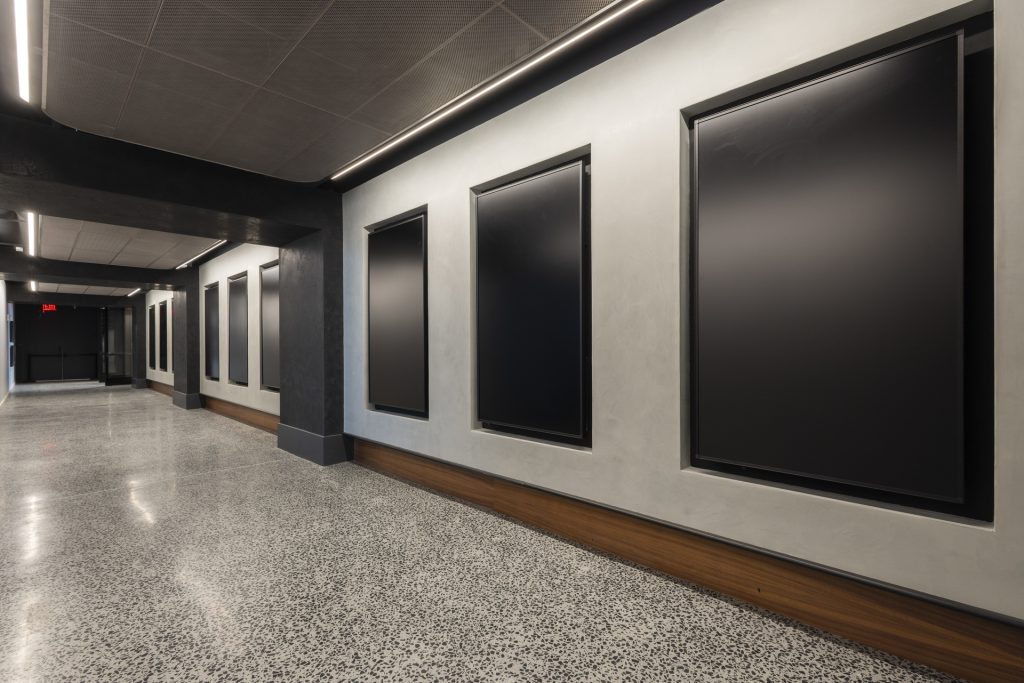 Gallery corridor with empty display frames and polished concrete floors at starrett lehigh ready for exhibitions or fashion activations